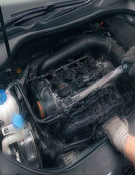 Mechanic working in an open engine bay